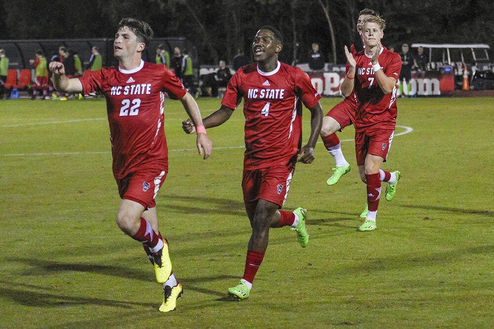 Members of the men's soccer team celebrate a goal during the match against UNC-Chapel Hill on Friday,&#160;Oct. 14, 2022 at Dail Soccer Field. NC State tied 2-2 with UNC-Chapel Hill.