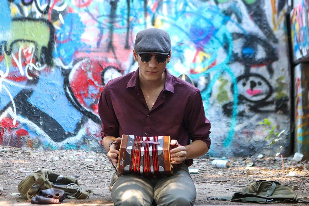 Eli Secosky, known as the "NC State accordion guy," plays the concertina in the Free Expression Tunnel on Saturday, Sept. 17, 2022. "I play at the Free Expression Tunnel on campus because I know it is very inspiring for people, and they really enjoy it. I have been able to make friends because of it," Secosky said.