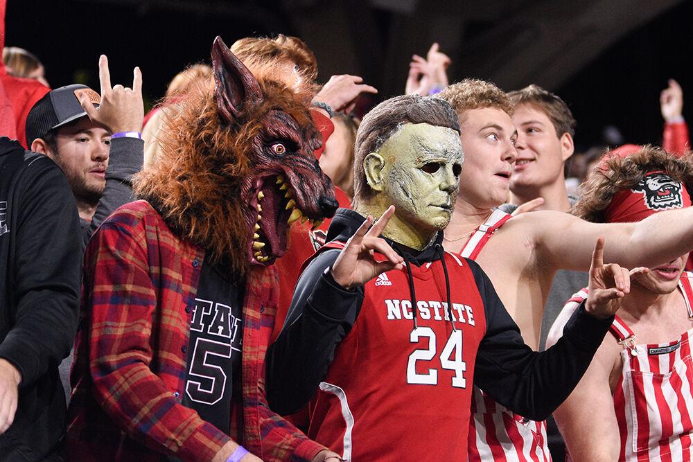 Luke Heylar (left), a first-year studying mathematics, and Jaxon Treder (right), a first-year studying textile engineering, dress up for Halloween during the Wolfpack's game against the Virginia Tech Hokies on Thursday, Oct. 27, 2022 at Carter-Finley Stadium. The Wolfpack beat the Hokies 22-21.
