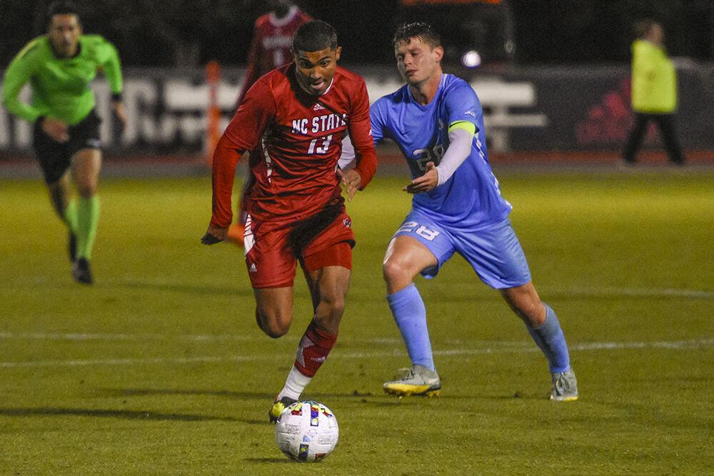 Freshman midfielder Calem Tommy runs with the ball during the match against UNC-Chapel Hill on Friday,&#160;Oct. 14, 2022 at Dail Soccer Field. Tommy had one shot on goal.&#160;NC State tied 2-2 with UNC-Chapel Hill.