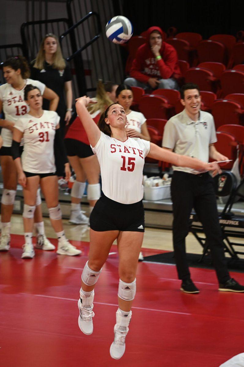 Freshman middle blocker Lily Cropper serves the ball against Clemson on Friday, Oct. 28, 2022 in Reynolds Coliseum. Cropper got one kill and one dig for Wolfpack. NC State won the game 3-0 against Clemson.