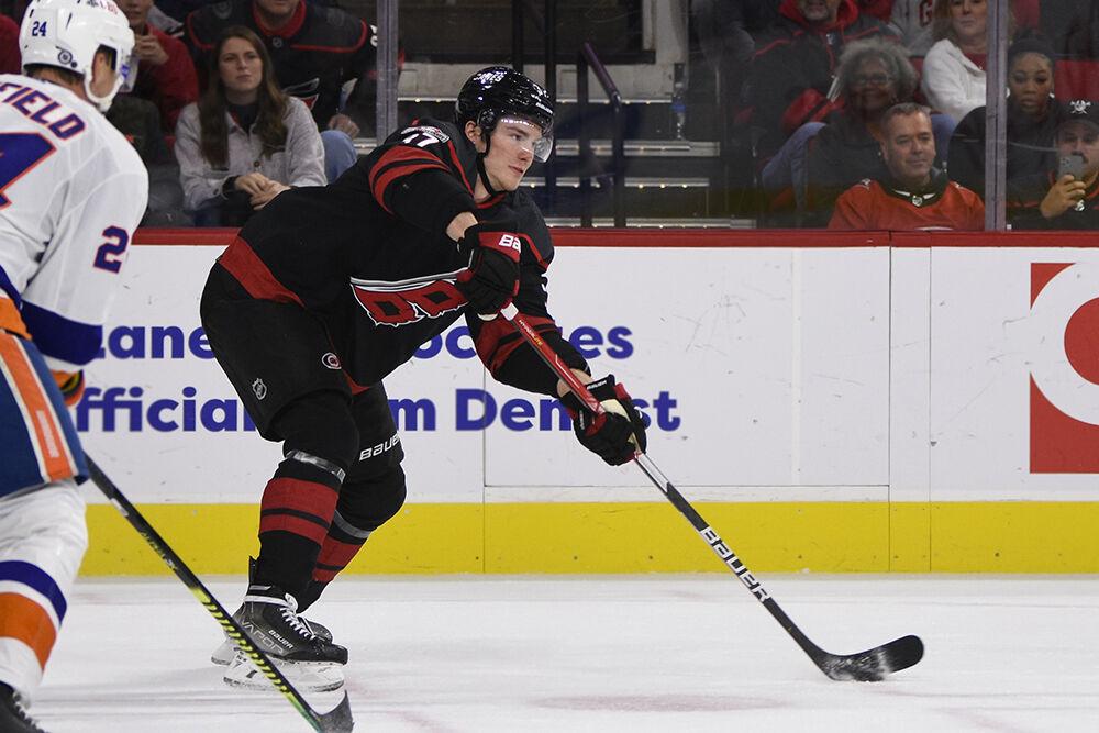 Right wing Andrei Svechnikov passes the puck during the game against the New York Islanders in PNC Arena on Friday, Oct. 28, 2022. Svechnikov had three shots. The Hurricanes lost 6-2.