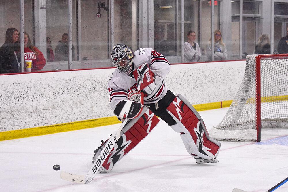 Senior goaltender Eric Daniel passes the puck during the game versus the University of Mary at Wake Competition Center on Thursday, Oct. 13, 2022. The Icepack lost to the Marauders 4-0.