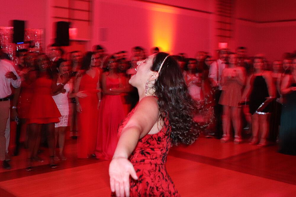 Lily Mersel, a first-year studying genetics, twirls in the dance circle at the Red and White Ball in Talley Student Union on Saturday, Oct. 22, 2022.