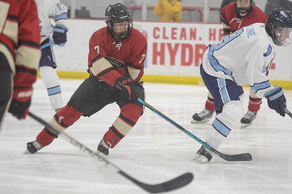 Sophomore forward Zach Robinson races for the puck during the NC State versus UNC-Chapel Hill game at Wake Competition Center on Friday, Sept. 30, 2022. NC State lost 5-3.