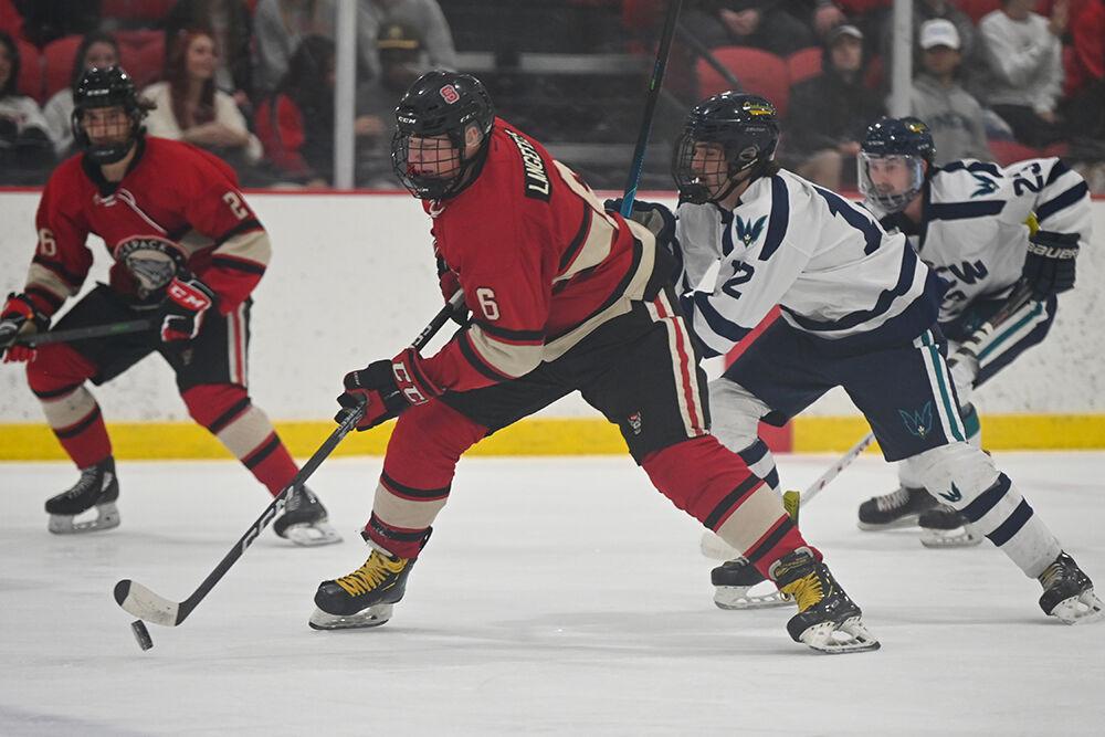 Freshman defenseman Kameron Langefels takes the puck up the ice during the game against UNC-Wilmington at Wake Competition Center on Friday, Oct. 14, 2022. Langefels had two goals. Icepack won 4-1.