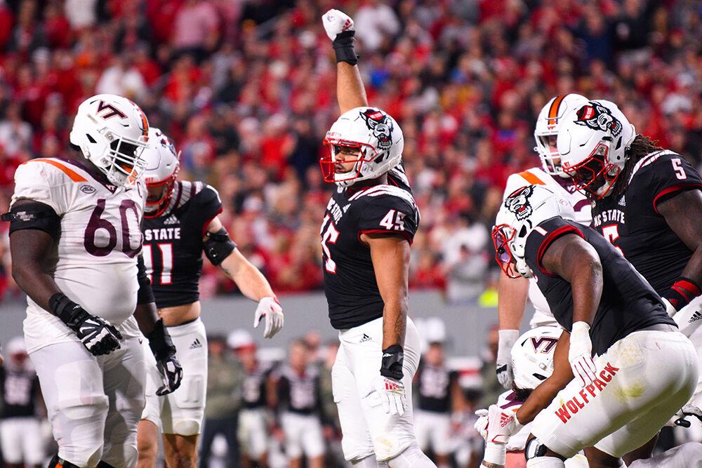Sophomore defensive tackle Davin Vann pumps his fist in excitement during the football game against Virginia Tech on Thursday, Oct. 27, 2022 at Carter-Finley Stadium. The Pack beat the Hokies 22-21.&#160;