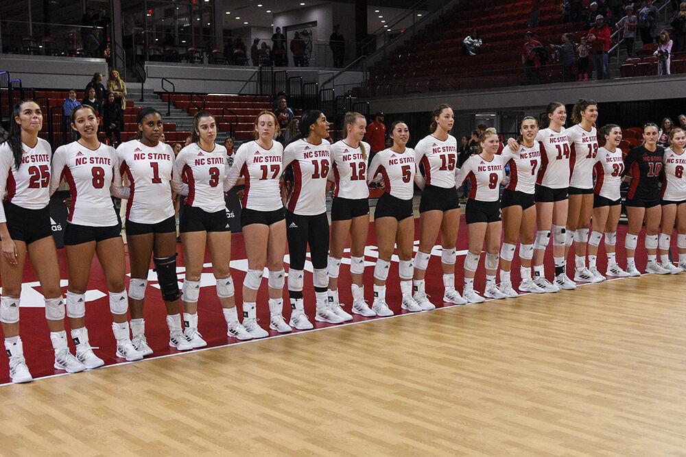 The NC State volleyball team stands in line at the conclusion of the game against Florida State on Friday, Sept. 30, 2022 in Reynolds Coliseum. Bukilic made six kills throughout the game. NC State won the game 3-0.