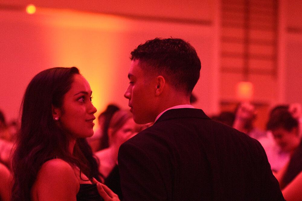 Kimberly Caputo, a second-year studying English, dances with Noel Garcia on Saturday, Oct. 22, 2022 at Talley Student Union. According to their webiste, the Red &amp; White Ball is NC State's annual formal dance and is hosted by the University Activities Board.