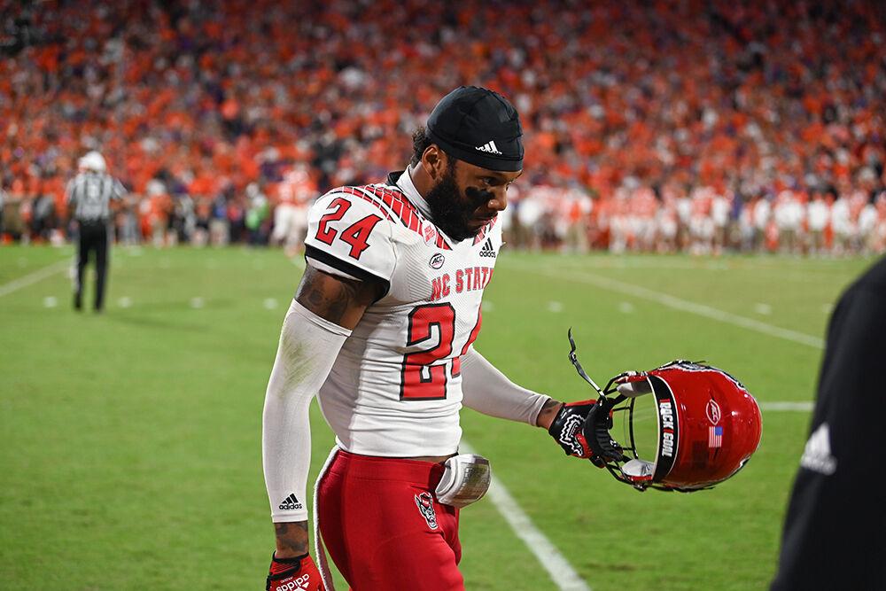 Graduate student cornerback Derrek Pitts Jr. removes his helmet during the game against Clemson on Saturday, Oct. 1, 2022 in Clemson Memorial Stadium. Pitts Jr. had six total tackles. The Wolfpack lost to the Tigers 30-20.