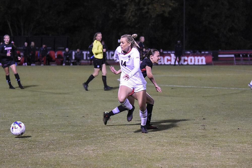 Forward junior Mia Vaughan passes the ball during the match against Louisville on Thursday, Oct. 20, 2022 at Dail Soccer Field. Vaughan attempted one shot on the goal for the Wolfpack. NC State lost 1-0 to Louisville.