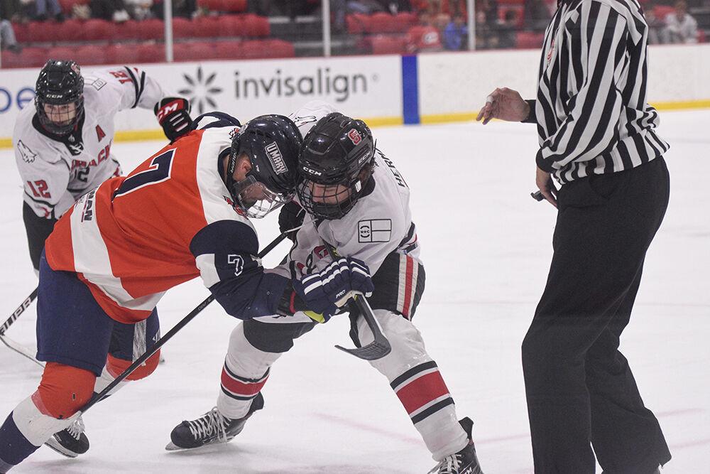 Freshman forward Zach Herman wrestles the opponent during the game versus the University of Mary at Wake Competition Center on Thursday, Oct. 13, 2022. The Icepack lost to the Marauders 4-0.
