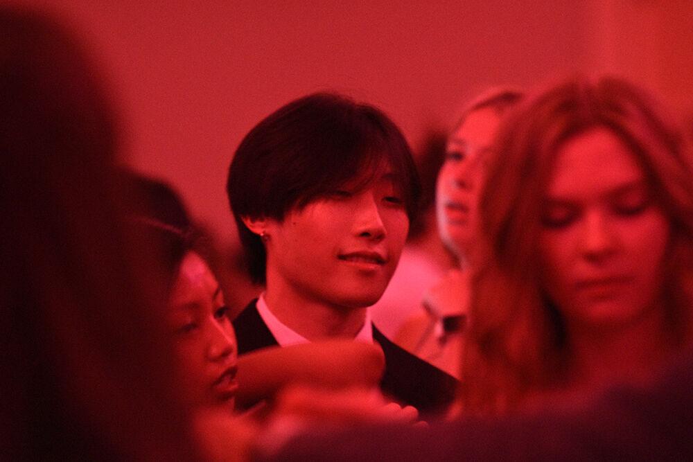David Kim, a first-year studying management, enjoys the music at the Red and White Ball on Saturday, Oct. 22, 2022 at Talley Student Union. The Red &amp; White Ball was NC State's annual formal dance and was hosted by the University Activities Board.