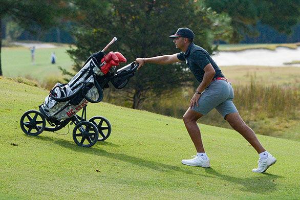 Junior Spencer Oxendine walks to the next hole during the Wolfpack Intercollegiate on Sunday, Oct. 16, 2022 at Lonnie Poole Golf Course.&#160;Oxendine tied for 50th with a final 54-hole score of 9-over. NC State tied for second overall.&#160;