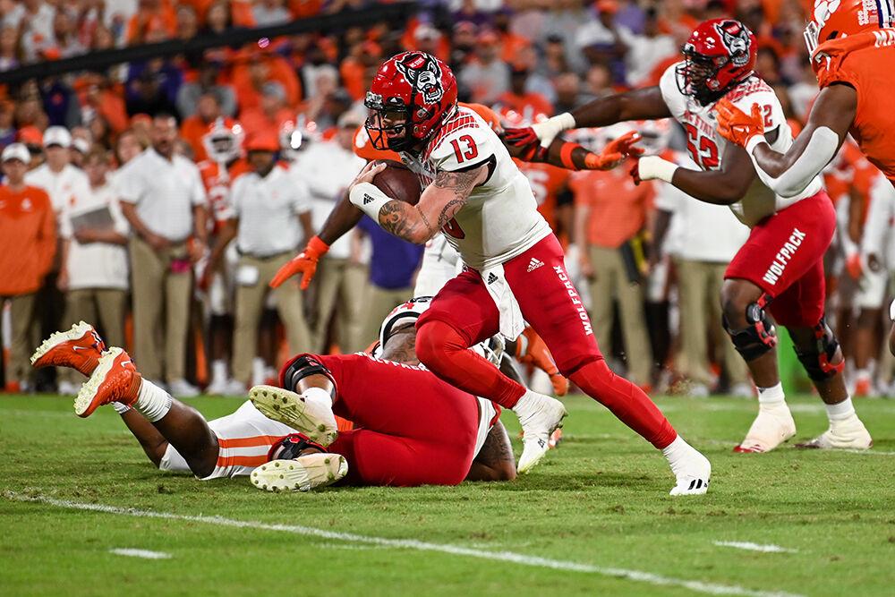 Redshirt junior quarterback Devin Leary rushes toward the end zone during the game against Clemson on Saturday, Oct. 1, 2022 at Clemson Memorial Stadium. Leary rushed for one touchdown during the game. NC State lost to Clemson 30-20.