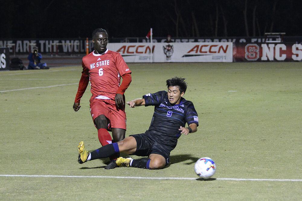 Senior defender Kendall Edwards kicks the ball past an opponent during the match against High Point University on Tuesday, Oct. 4, 2022 at Dail Soccer Field. Edwards made one assist for the Wolfpack. NC State beat High Point University 2-0.