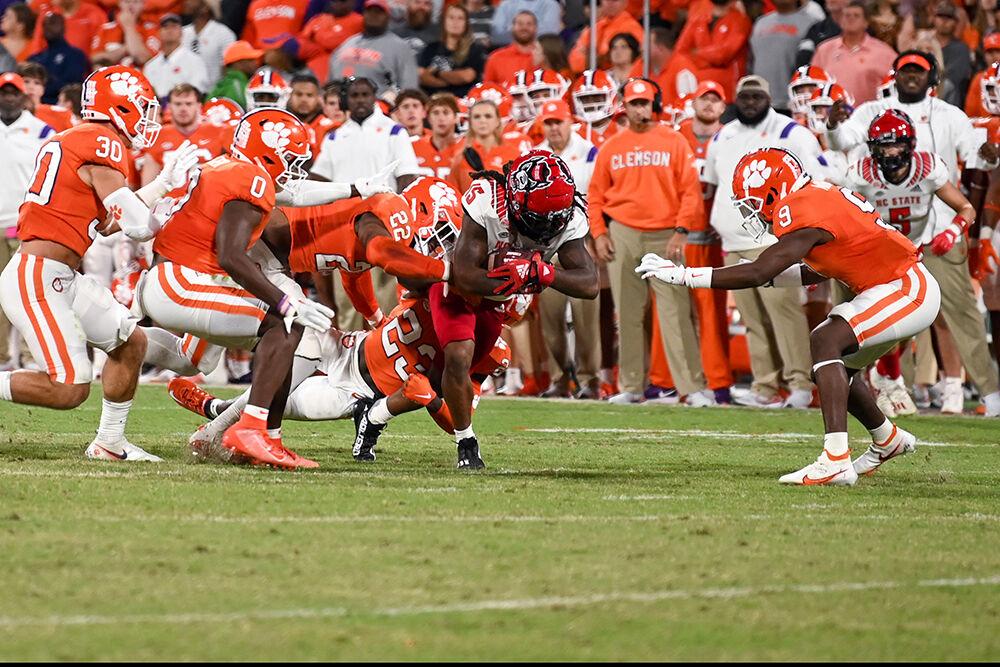 Junior wide receiver Keyon Lesane breaks tackles during the game against Clemson on Saturday, Oct. 1, 2022 at Clemson Memorial Stadium. Lesane had six receptions totaling 37 yards. The Wolfpack lost to the Tigers 30-20.