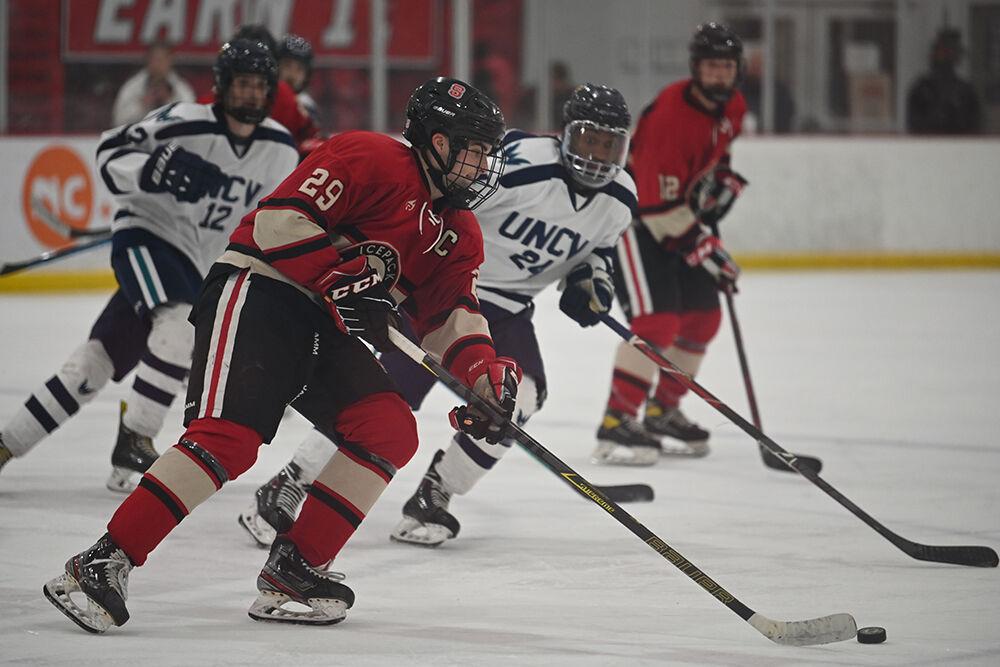 Senior defenseman Victor Hugo takes the puck up the ice during the game against UNC-Wilmington at Wake Competition Center on Friday, Oct. 14, 2022. The Icepack won 4-1.