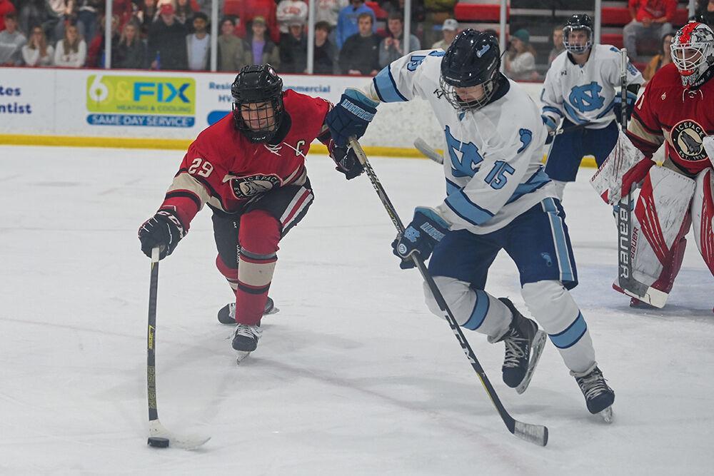 Senior defenseman Victor Hugo fights for the puck during the game against UNC-Chapel Hill player at Wake Competition Center on Friday, Sept. 30, 2022. Icepack lost 5-3.