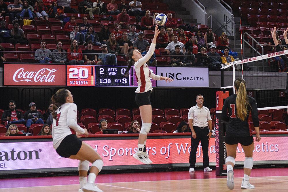 Sophomore open hitter Martyna Leoniak tips the ball during the game against Florida State on Friday, Sept. 30, 2022 in Reynolds Coliseum. Leoniak made 11 kills throughout the game. NC State won the game 3-0.