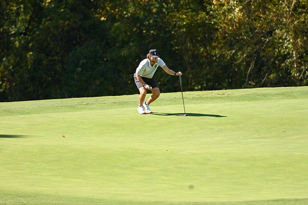 Redshirt sophomore Jake Herring surveys the line to the hole during the Wolfpack Intercollegiate at the Lonnie Poole Golf Course on Saturday, Oct. 15, 2022. Herring tied for 63rd in the tournment and was 12-over par. NC State tied for second.