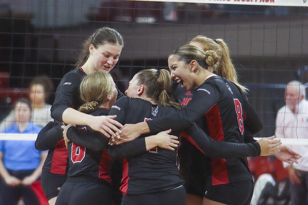 NC State Wolfpack celebrate after a kill during the match against Miami on Sunday,&#160;Oct. 2, 2022 in Reynolds Coliseum. NC State beat Miami 3-1.