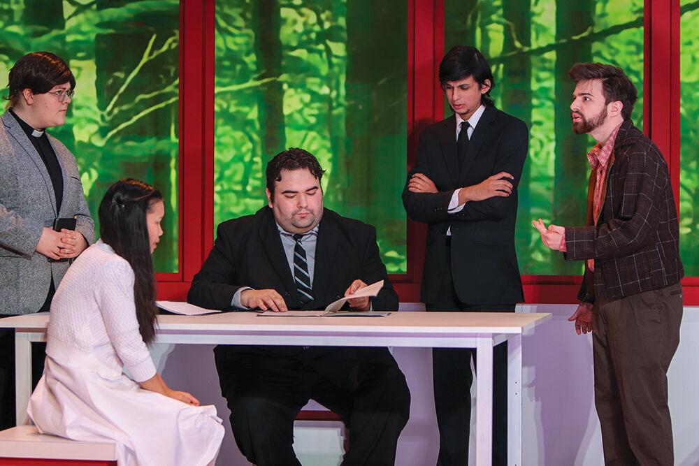 Cast members of The Crucible discuss the confession of Skye Pham, a fourth-year studying sustainable materials and technology, as Mary Warren in court during the show in Stewart Theatre Oct. 18, 2022. The play revolved around the Salem Witch Trials of the late seventeenth century.