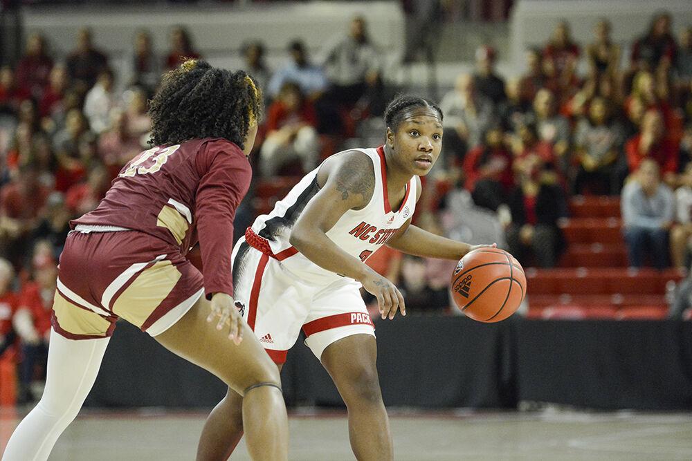 Junior guard Diamond Johnson surveys the court during the game against Elon at Reynolds Coliseum on Thursday, Nov. 10, 2022. Johnson led the team in scoring with 18 points on 63.6% shooting. NC State beat Elon 89-55.