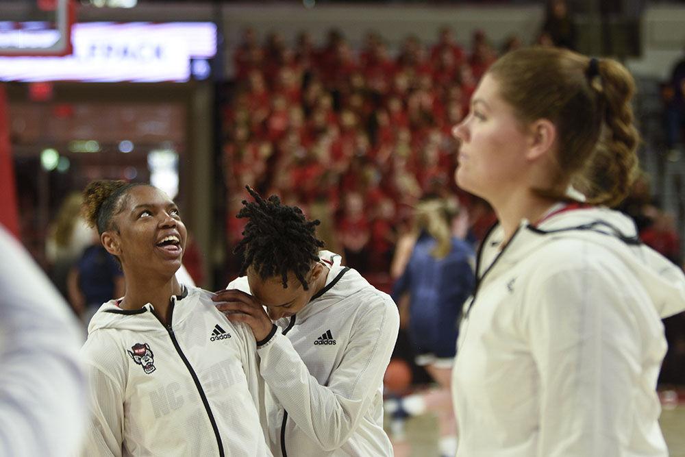 Sophomore guard Saniya Rivers (left) and sophomore guard Aziaha James (center) share banter during warm-ups before the game against Mount St. Mary's at Reynolds Coliseum on Sunday, Nov. 13 2022. Rivers scored one point and assisted another, and James scored 19 points and asissted two. NC State beat Mount St. Mary's 86-38.