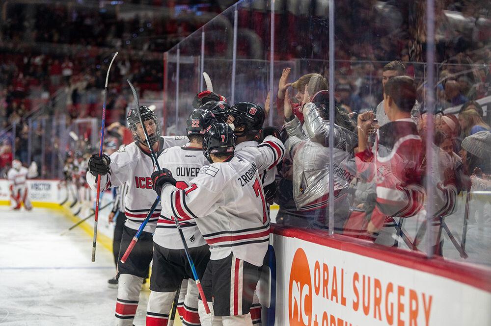 The NC State Icepack team gathers to celebrate scoring a goal during the Governor's Cup game against the UNC Tar Heels on Monday, Nov. 21, 2022&#160;in PNC Arena. The Icepack lost to the Tar Heels 4-2.