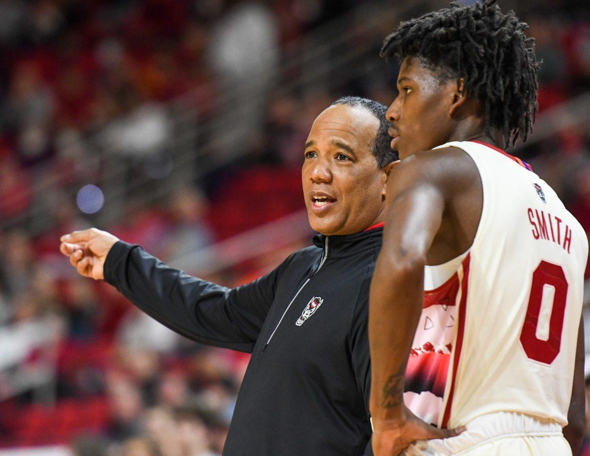 Head coach Kevin Keatts gives direction to freshman guard Terquavion Smith during the game versus the Syracuse Orange on Wednesday, Feb. 2, 2022 in PNC Arena. Smith led NC State with 25 points against Syracuse. The Wolfpack lost to the Orange 89-82.