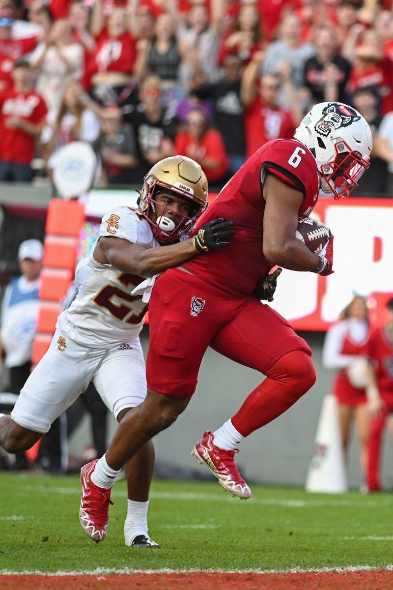 Redshirt junior tight end Trent Pennix fights for a touchdown against a Boston College defender during the game on Saturday, Nov. 12, 2022 at Carter-Finley Stadium. Pennix had 53 receiving yards and a touchdown. NC State lost to Boston College 21-20.