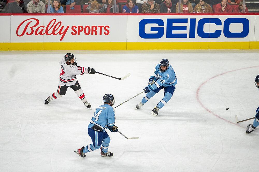 Senior forward Garrett Auriene shoots the puck towards the opposing goal during the Governor's Cup game against the UNC Tar Heels on Monday, Nov. 21, 2022 in PNC Arena. The Icepack lost to the Tar Heels 4-2.