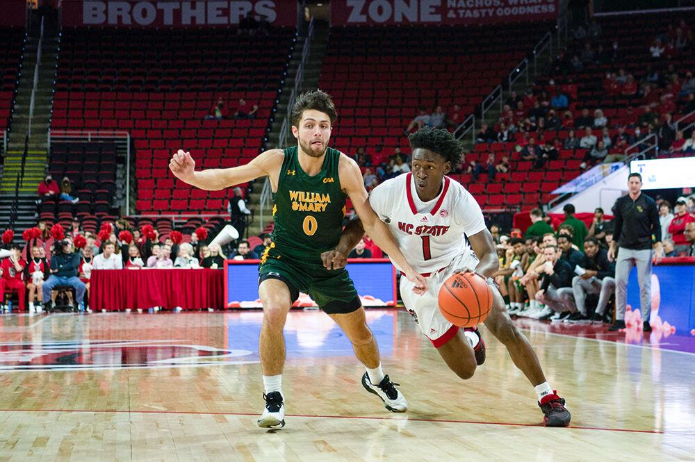 Graduate guard Jarkel Joiner dribbles around an opponent during the game versus William &amp; Mary at PNC arena on Tuesday, Nov. 29, 2022. Joiner made five field goals, four rebounds and scored 11 points. The Wolfpack beat the Tribe 85-64.