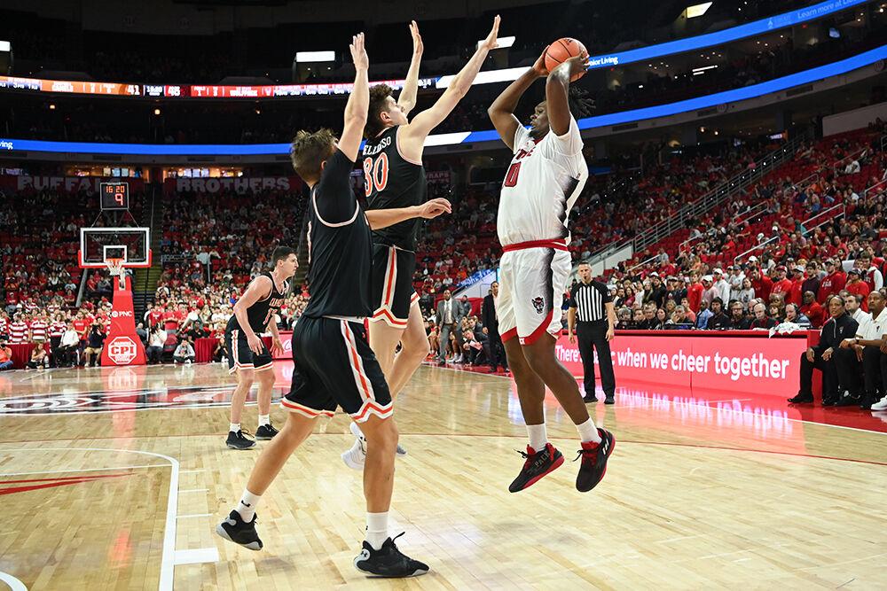 Graduate forward DJ Burns shoots over the block during the game against Campbell on Friday, Nov. 11, 2022 in PNC Arena. Burns scored four points for the Wolfpack. NC State beat Campbell 73-67.