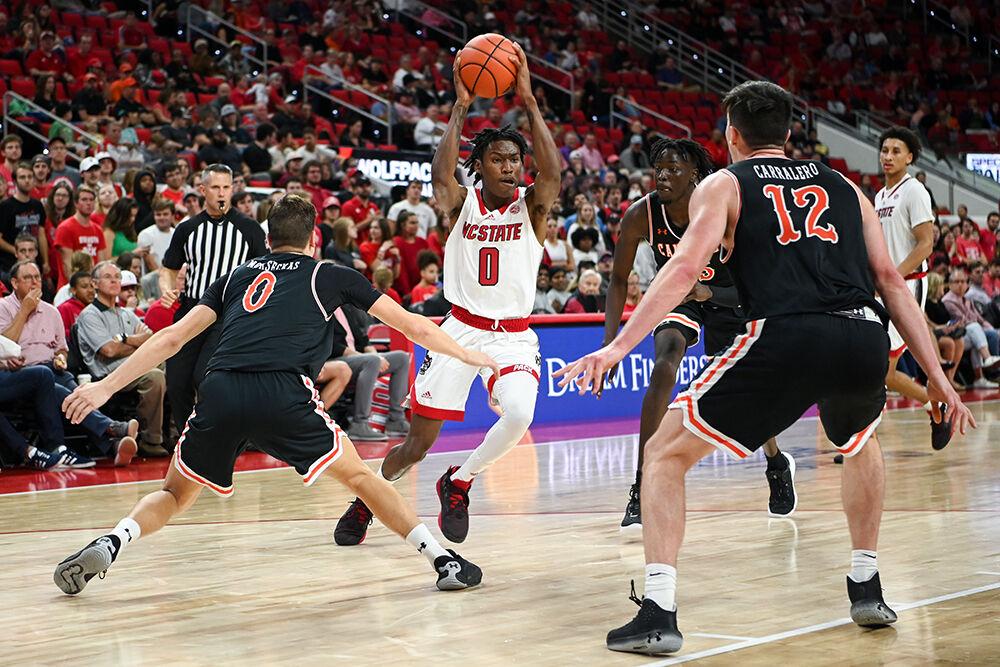 Sophomore guard Terquavion Smith looks to pass the ball to a teammate during the game against Campbell on Friday, Nov. 11, 2022 in PNC Arena. Smith led in scoring with 19 points and six assists for the Wolfpack. NC State beat Campbell 73-67.