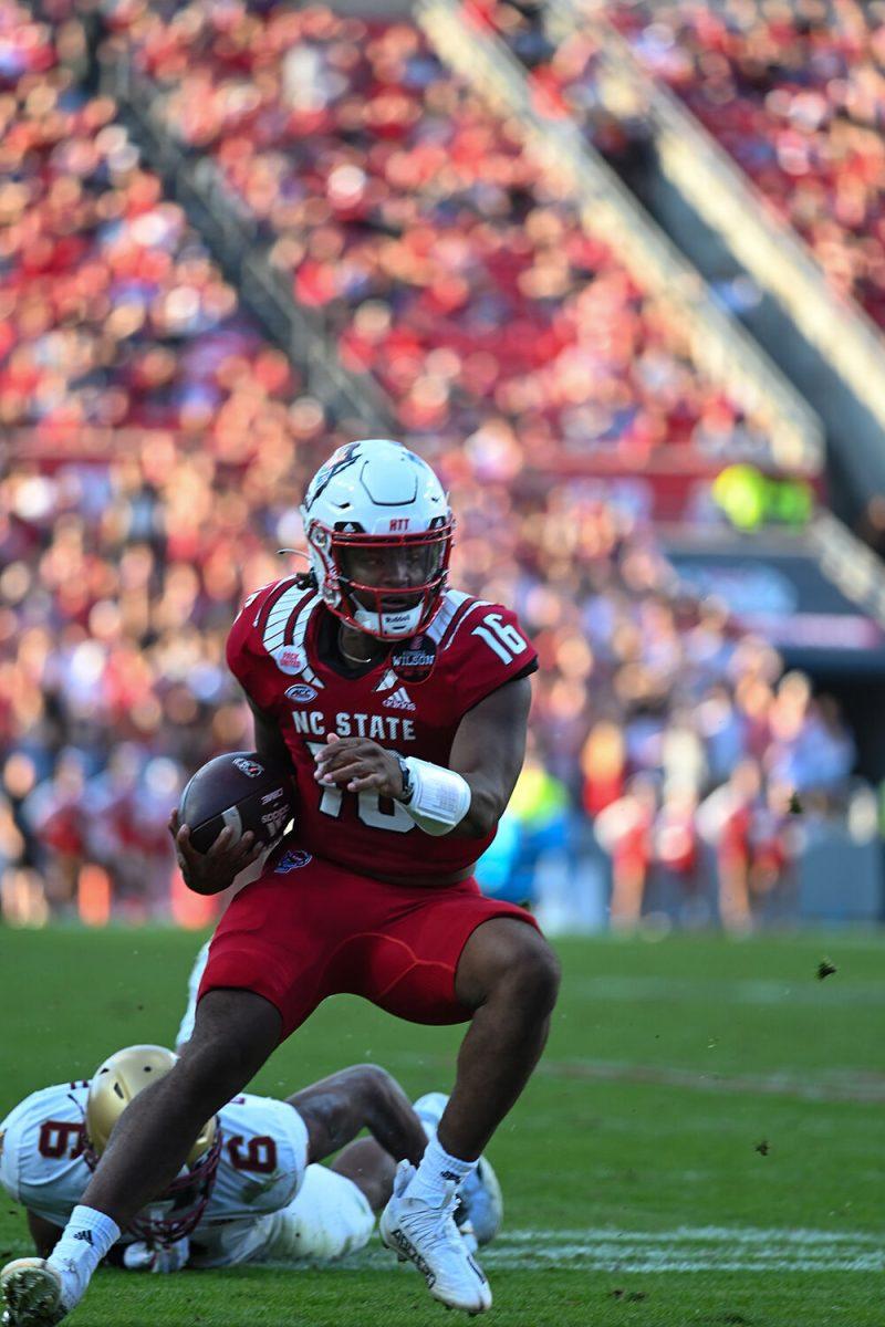 Freshman quarterback MJ Morris scrambles for a gain on Saturday, Nov. 12, 2022 in Carter-Finley Stadium. Morris had 135 passing yards and a touchdown. NC State lost to Boston College 21-20.