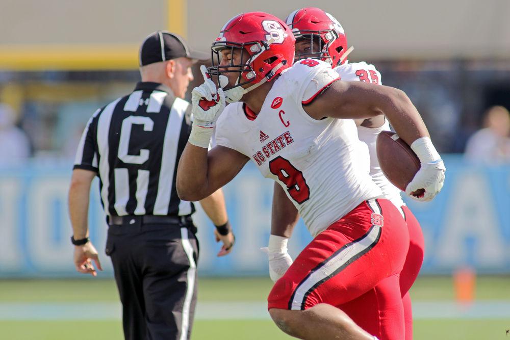 Junior defensive end Bradley Chubb comes away with the fumble recovery in the first quarter against UNC on Nov. 25, 2016 at Kenan Memorial Stadium. The Wolfpack won 28-21.