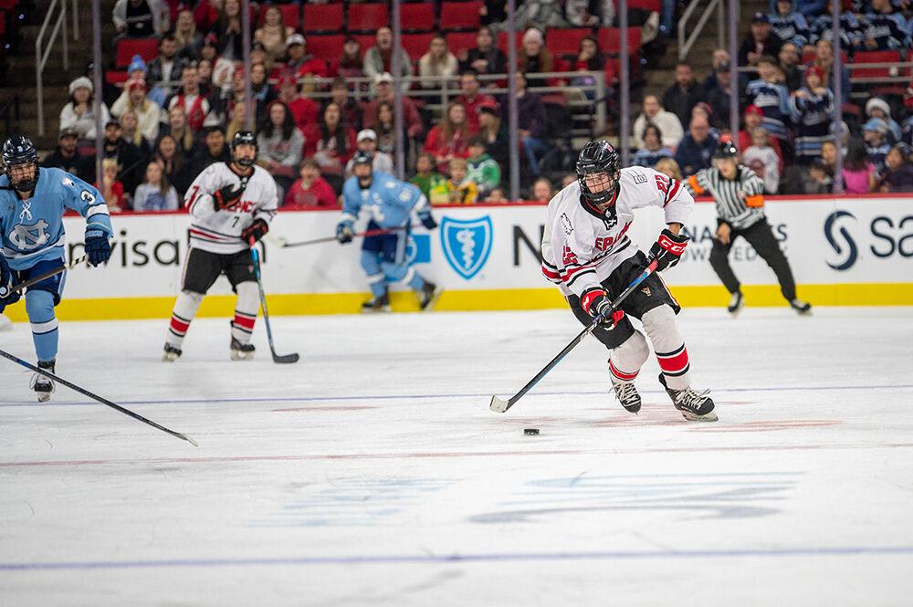 Sophomore forward Emery Oliver moves the puck down the ice during the Governor's Cup game against the UNC Tar Heels on Monday, Nov. 21, 2022&#160;in PNC Arena. The Icepack lost to the Tar Heels 4-2.