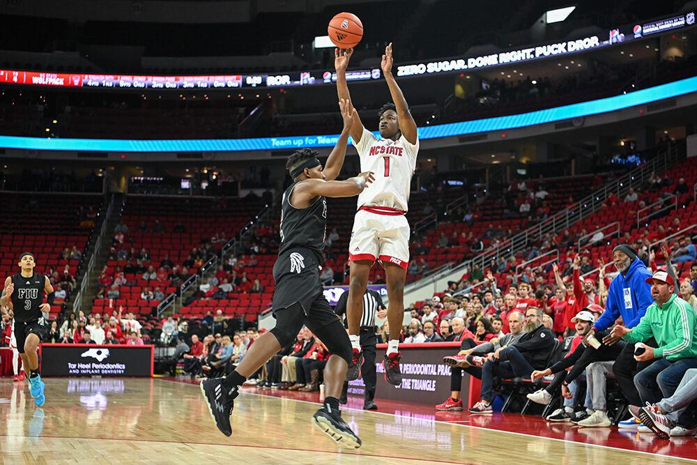 Graduate guard Jarkel Joiner shoots a 3-pointer during the game against Florida International University on Tuesday, Nov. 15, 2022 in PNC Arena. Joiner scored 26 points and made five assists for the Wolfpack. NC State beat Florida International University 107-74.