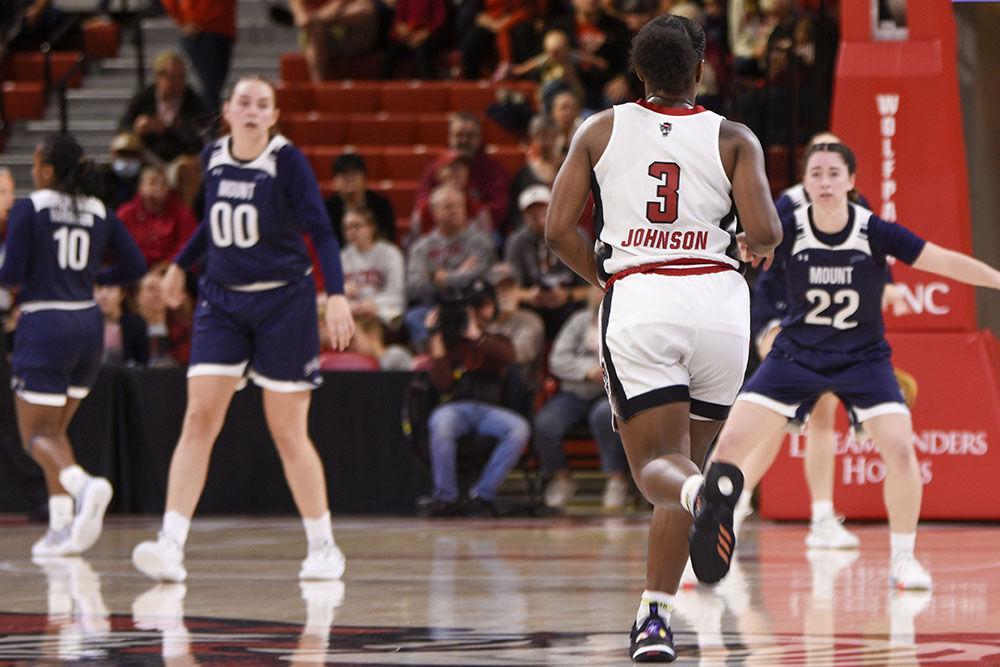 Junior guard Diamond Johnson confronts Mount St. Mary's defense at the game at Reynolds Coliseum on Sunday, Nov. 13 2022. Johnson scored 13 points and assisted four. NC State beat Mount St. Mary's 86-38.
