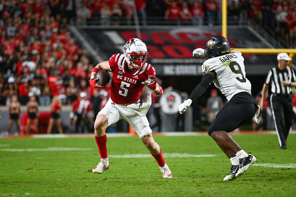 Graduate wide receiver Thayer Thomas runs after a reception in the NC State victory over Wake Forest on Saturday, Nov. 5, 2022 at Carter-Finley Stadium. Thomas had eight receptions for 79 yards during the game.&#160;NC State defeated Wake Forest 30-21.&#160;