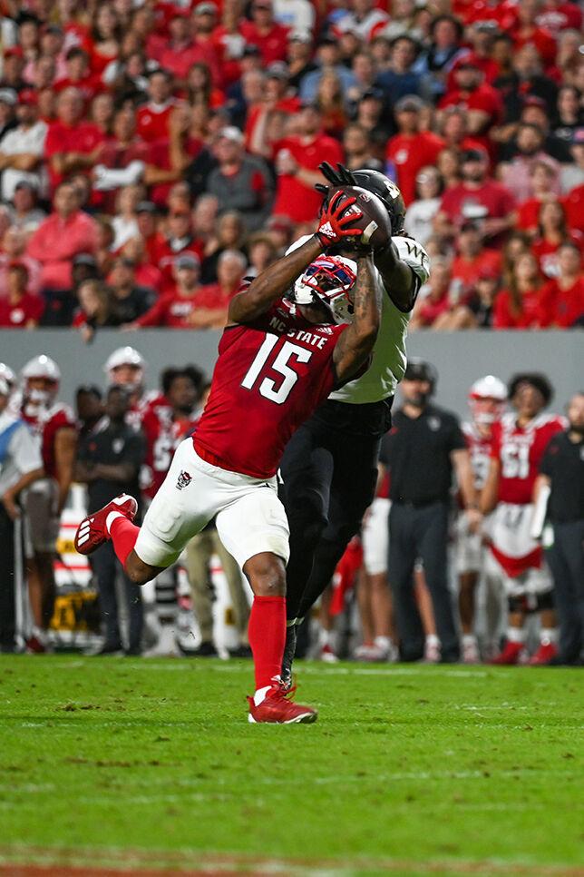 Junior wide receiver Keyon Lesane makes a catch against a Wake Forest defender in the NC State victory over Wake Forest on Saturday, Nov. 5, 2022 at Carter-Finley Stadium. Lesane had 71 receiving yards and a touchdown in the win.&#160;NC State defeated Wake Forest 30-21.