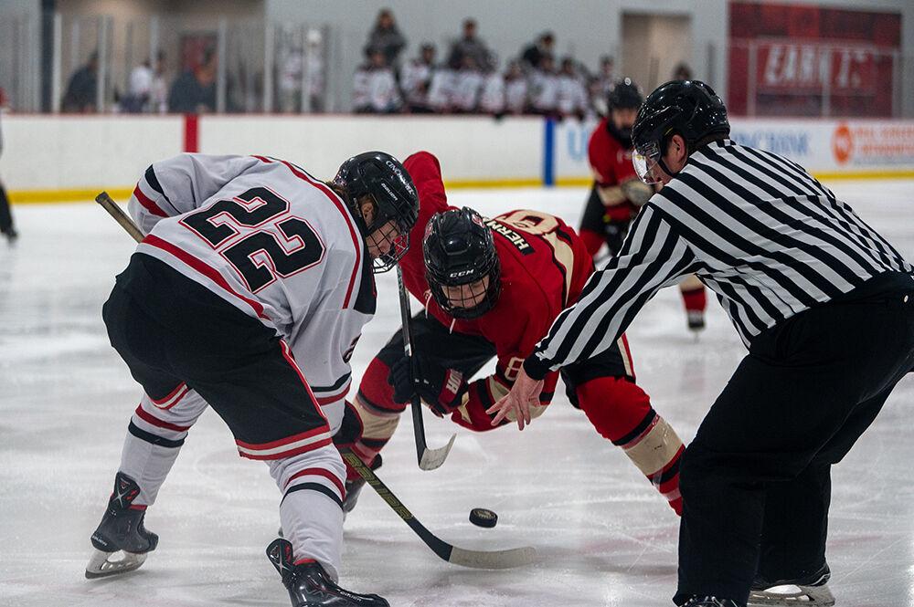 Freshman forward Zack Herman attempts to steal the puck during a penalty, during the game against Cincinnati Bearcats at Wake Competition Center on Saturday, Nov. 19, 2022. The Icepack beat the Bearcats 4-3.