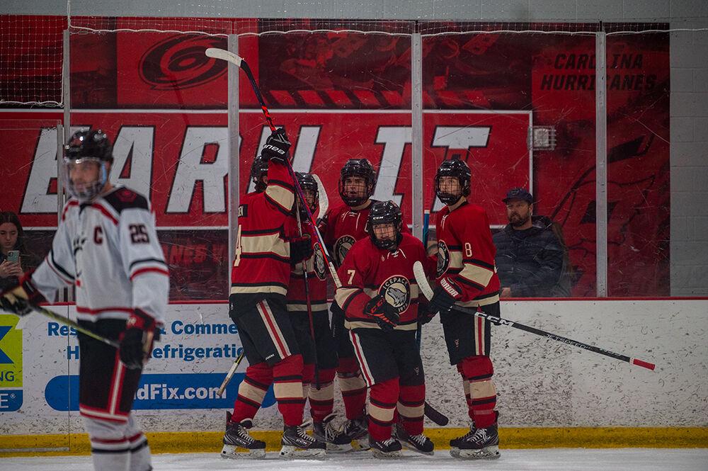The Icepack hockey team gathers to celebrate scoring a goal during the game against Cincinnati Bearcats at Wake Competition Center on Saturday, Nov. 19, 2022. The Icepack beat the Bearcats 4-3.