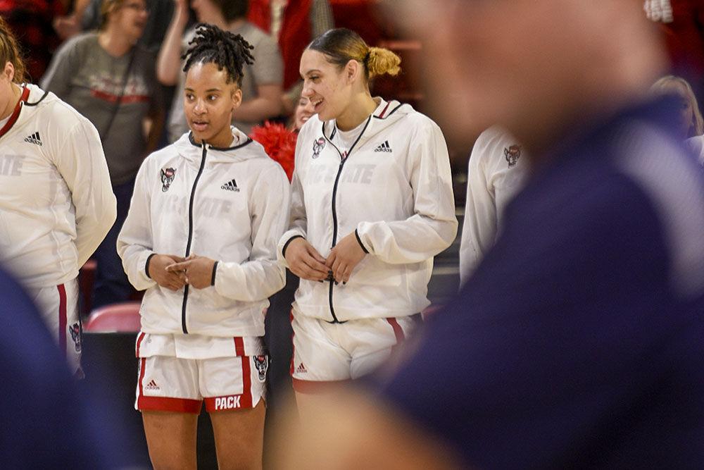 Sophomore guard Aziaha James (left) and graduate forward Mimi Collins converse before the game against Mount St. Mary's at Reynolds Coliseum on Sunday, Nov. 13, 2022. James scored 19 points and assisted two, and Collins scored nine. NC State beat Mount St. Mary's 86-38.