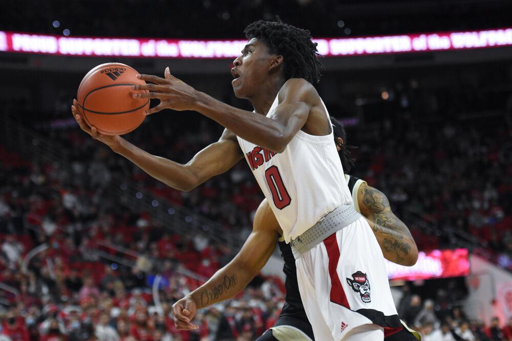 Freshman guard Terquavion Smith goes for a shot during the game against the Wake Forest game in PNC Arena on Wednesday, Feb. 9, 2022. Smith scored eight points before being fouled out in the second half. The Wolfpack lost 69-51.