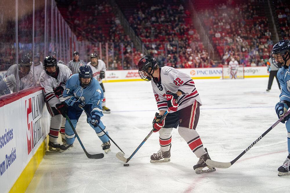 Sophomore forward Emery Oliver defends the puckduring the Governor's Cup game against the UNC Tar Heels on Monday, Nov. 21, 2022&#160;in PNC Arena. The Icepack lost to the Tar Heels 4-2.