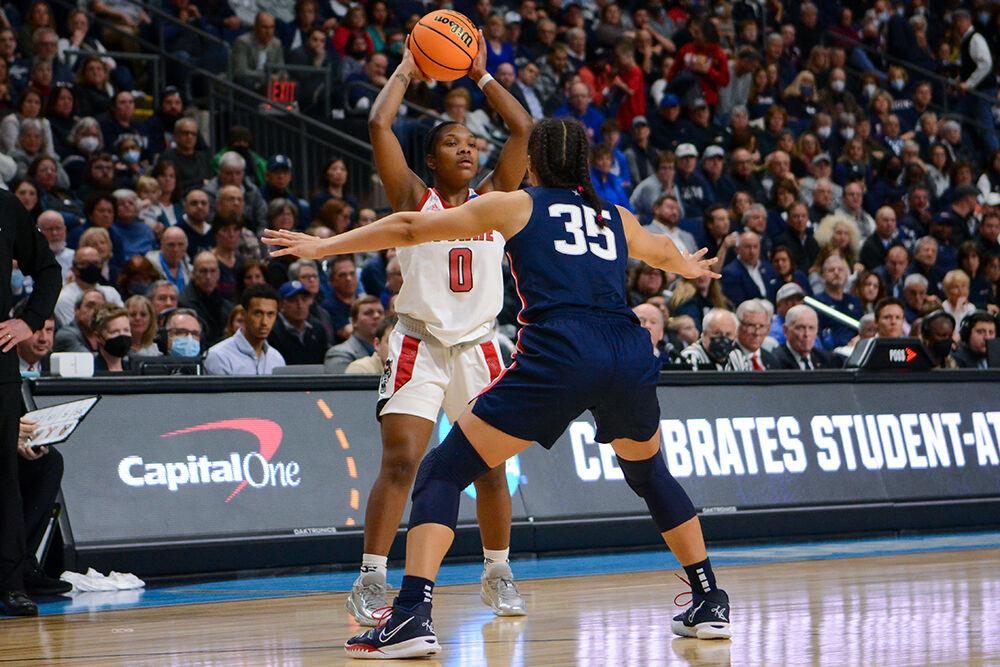 Sophomore guard Diamond Johnson looks to pass the ball to a teammate in the Elite 8 game against Connecticut on Monday, March 28, 2022 inside Total Mortgage Arena in Bridgeport, Connecticut. Johnson scored 8 points for the Wolfpack. NC State lost 91-87 to Connecticut in double overtime.