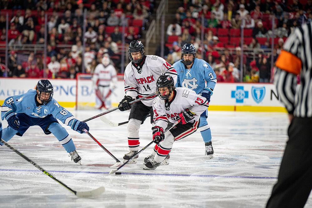 Senior center Alex Fong moves the puck down the ice during the Governor's Cup game against the UNC Tar Heels on Monday, Nov. 21, 2022&#160;in PNC Arena. The Icepack lost to the Tar Heels 4-2.